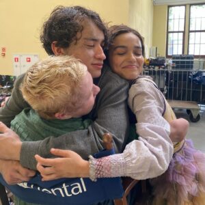 Rachel Zegler Instagram - a lil toast to my lil tribute babies (+ my baby cousin maude ivory), who made me a big sister (or just a regular sister… i know some of y’all are older it’s ok we’re ok calm down) and made me feel the happiest i ever have on a set before. the support amongst this cast is so real, and it’s been the best time ever to watch my fellow tributes on the big screen. and even better to share this moment with them. the number one movie in the world?!?!? these tributes are the reason. they’re so absolutely incredible and i love them all madly. DO ME A FAVOR: go out and see them in theaters this weekend. 🩷🐍🕊️

(i know some of you aren’t pictured but i am tagging you anyway because i love you so much.)

also that last photo is the reality of working on the set of the hunger games. mannequins EVERYWHERE.