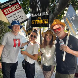 Rainn Wilson Instagram - Ran into old friends at the picket lines today at Warner Brothers!

Folks, this is about middle-class writers and actors trying to feed their families and pay their mortgages. This new streaming business model that has (impetuously and without any long-term consideration) transformed the entire industry over the last 5 years, has completely screwed over working class creatives in Hollywood in all kinds of ways - more draconian contracts, little to no residuals, and less writers room hires. For instance: remember the 57 BILLION MINUTES of The Office viewed on Netflix in 2020? Our “residuals” for that historic run were beyond pathetic. Netflix made out ok, however - a 27% jump and profits of 9B that year. Follow: @sagaftra for more info.
