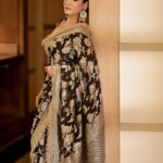 Raveena Tandon Instagram - Who better than Raveena Tandon (@officialraveenatandon) to celebrate the timeless allure of handwoven sarees! Someone who sparked the biggest of fashion trends and gave Bollywood some of the most iconic fashion moments, the actor harbours a special love for the six yards of silk. The beauty looks mesmerising in a black weave paired with a pair of statement earrings. The unconventional colour is a sure shot headturner in a sea of reds and maroons. Her subtle makeup: a feather light base, nude lipstick drenched in gloss and a touch of kohl on the eyes complements the look. Follow Showstoppers for more inspiration to make a style statement this wedding season. Concept & styling: @sharaashraf Photos: @amitkhannaphotography Production: @shweta__sunny & @kayanaaaaat Makeup and hair: @kin_vanity Location: @itcmaratha Outfit: Saree by @meerabypoornimasharma Jewellery: @sahai_ambar_pariddi #raveenatandon #raveenatandonfans #weddingspecial #weddingseason #weddingstyle #weddingoutfit #weddingoutfits #saree #sareelover #sareelove #varanasi @raveenatandonfanpage @raveenatandonbiggestfan @raveenatandon_trueadmirer @raveenatandonfan_
