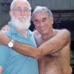 Sarah Silverman Instagram - My beloved step-dad, John O’Hara, died 16 years ago today. He was a quiet, kind, beautiful man. His love language was building things - he built the bed I slept on and the porch we spent our summers on. He kept the wood stove going in the winter, and even tolerated my loud obnoxious (adorable) Dad - pictured with him shirtless) He always gave me the classic step-dad side hug and he’d joke “I don’t care what they say — I like you!” but I knew the truth- he loved me. And I hold onto that now more than ever.
