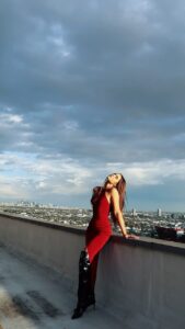 Savannah Clarke Instagram - T H E W E S T S I D E __________________________________ A sunflower soul With rock and roll eyes Curious thoughts & a heart of surprise ____________________________________ #LookToThePositive #Optimistic #arianagrande #PositiveVibes #RedDress #RoofatopViews #VideoGram #SunSets #GoldenHour #LongBoots #CityViews #RoofTop #LAVibe #california ____________________________________ Los Angeles, California