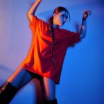 Savannah Clarke Instagram – I N T O 
T H E 
B L U E 
___________________________________

To shine your brightest light
Is to be who you truely are. 

____________________________________
#IntoTheBlue #BlueLight #Portrait_Visions #TakenByMe #PlayingWithLight #Contrast #UltraVioletLight #Orange #TshirtDress #LongBoots #KeepShining #ShineBright
___________________________________
_____________________________________ Sydney