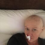 Shannen Doherty Instagram – For breast cancer awareness month, I’d like to share more of my own personal journey from my first diagnosis to my second. Is it all pretty? NO but it’s truthful and my hope in sharing is that we all become more educated, more familiar with what cancer looks like. I hope I encourage people to get mammograms, to get regular checkups, to cut thru the fear and face whatever might be in front of you. In 2015 I got diagnosed with breast cancer. I had a mastectomy and did chemo and radiation. I had many nose bleeds from the chemo. Not sure if any of you experienced this. I also was beyond tired. I cheered myself up by putting on funny pajamas that my friend Kristy gave me. Did they actually cheer me up? Yes!! Lol. I looked ridiculous and in that ridiculousness, I was able to laugh at myself. Finding humor helped get me thru what seemed impossible. I hope we all find humor in the impossible. #breastcancerawareness