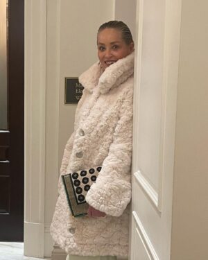 Sharon Stone Instagram - 🤍 This Coat! Love you @couture.to.the.max!

Creative Director/ Stylist: @theparislibby for @aframe_agency 
Coat: @couture.to.the.max 
Dress: @eliesaabworld
Bag: @fendi
Jewelry: @emmanuel_tarpin