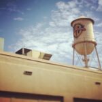 Taissa Farmiga Instagram - So I can’t post any juicy pictures but please take this general WB water tower pic and the below as consolation: Just saw #TheNunMovie for the first time and all I can say is— Holy... Nun... ❗️❗️❗️I’m a ball of nerves and anxiety because I spent the past 90 minutes in a pitch black screening room watching the Demon Nun (@bonnieaarons1 🖤) wreak chaos and havoc in our Romanian Abbey. The movie is phenomenal! You guys are going to LOVE and I cannot wait to share it with you! I’m stoked to see some of you at the ScareDiego panel at Comic-Con next week!! Warner Bros. Studio