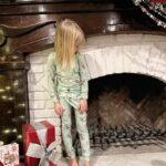 Tori Spelling Instagram - This was the ‘Night Before Christmas… Santa’s cookies baked & decorated by the kiddos and placed out with his milk { @lactaid bc we care} And, carrots and water for his hardworking reindeer. Beau dressed in his personalized Christmas pjs by @_littlenavy { which matched our family, pets, and elves even! Thx @_littlenavy the best! Beau is still sleeping in his 5 days after Christmas {yes, we washed them 😂} } and he says he intends to where them daily even when he goes back to school 🤷🏼‍♀️. Here he is showing Santa how his gifts should come down the chimney lol 😂. Love these moments! #christmasmemories #santa #holidayseason #christmaseve #christmaspjs . @marquecomm