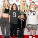 Tori Spelling Instagram - Jingle Ball 2023 … - Music , Kiddos, and Sequins OH MY! My kids and friends and family had the BEST time this past weekend! Thank you for everything @iheartradio @iheartjingleball you made a pre teen girl , teen girl , and moms dream come true seeing @oliviarodrigo . After a challenging 2023 it was everything to see Olivia! She’s been our anthem and music champion thru this time. We sang our hearts out to her. Grateful beyond words to my @iheartradio family!! Also grateful to our friends and hair/makeup goddesses that made all of us girlies look and feel special : @laurarugetti @julzhopemua @nicolevegahair ❤️. - 🙋🏼‍♀️ look: dress/ @_zhivago_ necklace/ @dylanlex hair/ @laurarugetti @hiddencrownhair . - Stella look/ MU @stella_mcdermott08 hair/ @laurarugetti using @laurarugetti x @hiddencrownhair clip ins color Malibu . Hattie/ MUA @julzhopemua hair/ @nicolevegahair . - Finn/ @urbanoutfitters . - Beau/ @calakids_boutique . - Photo Credit: Jesse Grant/ Getty Images for iHeartRadio @jgrantphoto Backstage photos: Carly Sharp ¡HeartRadio @carlyjeansharp . - Photo: @bentrivett @people @entertainmentweekly Kia Forum