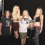 Tori Spelling Instagram - Jingle Ball 2023 … - Music , Kiddos, and Sequins OH MY! My kids and friends and family had the BEST time this past weekend! Thank you for everything @iheartradio @iheartjingleball you made a pre teen girl , teen girl , and moms dream come true seeing @oliviarodrigo . After a challenging 2023 it was everything to see Olivia! She’s been our anthem and music champion thru this time. We sang our hearts out to her. Grateful beyond words to my @iheartradio family!! Also grateful to our friends and hair/makeup goddesses that made all of us girlies look and feel special : @laurarugetti @julzhopemua @nicolevegahair ❤️. - 🙋🏼‍♀️ look: dress/ @_zhivago_ necklace/ @dylanlex hair/ @laurarugetti @hiddencrownhair . - Stella look/ MU @stella_mcdermott08 hair/ @laurarugetti using @laurarugetti x @hiddencrownhair clip ins color Malibu . Hattie/ MUA @julzhopemua hair/ @nicolevegahair . - Finn/ @urbanoutfitters . - Beau/ @calakids_boutique . - Photo Credit: Jesse Grant/ Getty Images for iHeartRadio @jgrantphoto Backstage photos: Carly Sharp ¡HeartRadio @carlyjeansharp . - Photo: @bentrivett @people @entertainmentweekly Kia Forum