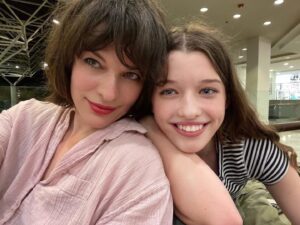Milla Jovovich Instagram - We’re finally in Newfoundland for the last leg of @everanderson’s new movie #peterpanandwendy! We spent the day walking around the gorgeous town and had lunch at the historic @mallardcottage which was so delicious. They even have their own garden in the backyard and in the last pic you can see the way they roast meat, slow and low on hot coals made of wood from the area. Ever and her co-star @alexandermolonyofficial who plays Peter Pan had a great time finding old bones scattered around and trying to guess what each plant was growing in the garden. It’s a seaside town of charming, old houses painted in brilliant colors, sweet and friendly people and even cool vintage clothing stores. In the evening we sit downstairs at our hotel with the rest of the cast and parents playing Empire for hours! I feel so lucky to be experiencing this with my amazing kiddo! #peterpanandwendy #disney #newfoundland