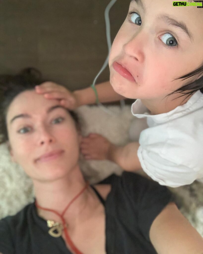 Lena Headey Instagram - She was giving me a massage .. She loves to do that .. She also loves witnessing you bang your head or trap a finger .. It makes her laugh . .. like … . Well like a proper nutter ..
Stubborn and tenacious, opinionated and funny, kind and curious, intuitive and observant .. Ted  LOVES  her people ferociously. 
May you always run with wolves and howl at the moon and cast whatever spells you desire .. 
though we battle DAILY (because you know everything and you’re always right) I love you beyond words, you glorious tiny woman you 👊❤️👊 #internationaldaughtersday