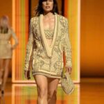 Milla Jovovich Instagram - What an unforgettable experience walking in @balmain celebrating their 75th anniversary and 10 years of the inimitable @olivier_rousteing !! It was so fun to be on the runway and even more fun to be off, getting a chance to hang with some amazing friends from the fashion industry, the gorgeous and talented @misskarenelson, the always incredible ladies @lara_stone and @mariacarlaboscono and have a romantic trip to Paris with my amazing husband to boot! Also huge thank you to @sammcknight1 for the beautiful hair and @ossielramosabarca for my luscious make up!! And I can’t forget @hollysilius @sokothecat and @philippeuter for taking all the great videos and showing me so much support from the front row while I was struttin my stuff!😘😘😘 And I want to send a HUGE shout out to my amazing trainer @theetiffmarie founder of @trampolinetrim who got me runway ready all these months ahead of the show! We did it mama!💪🏼💪🏼💪🏼😘😘😘
Clothes by @Balmain
Body by @trampolinetrim