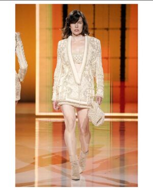 Milla Jovovich Instagram - What an unforgettable experience walking in @balmain celebrating their 75th anniversary and 10 years of the inimitable @olivier_rousteing !! It was so fun to be on the runway and even more fun to be off, getting a chance to hang with some amazing friends from the fashion industry, the gorgeous and talented @misskarenelson, the always incredible ladies @lara_stone and @mariacarlaboscono and have a romantic trip to Paris with my amazing husband to boot! Also huge thank you to @sammcknight1 for the beautiful hair and @ossielramosabarca for my luscious make up!! And I can’t forget @hollysilius @sokothecat and @philippeuter for taking all the great videos and showing me so much support from the front row while I was struttin my stuff!😘😘😘 And I want to send a HUGE shout out to my amazing trainer @theetiffmarie founder of @trampolinetrim who got me runway ready all these months ahead of the show! We did it mama!💪🏼💪🏼💪🏼😘😘😘
Clothes by @Balmain
Body by @trampolinetrim
