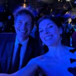 Milla Jovovich Instagram - What a gorgeous night for @amfar with my beautiful family! It’s been 22 years that I’ve been helping raise awareness for @amfar’s amazing fundraising to support AIDS research and now COVID research as well. I was so proud to have my husband  and my daughter with me to celebrate this gorgeous event and it was such an honor to wear a couture @jeremyscott gown and cheer him on when he received his award for all the amazing work he’s done with the organization! #amfar #makeaidshistory #makecovidhistory