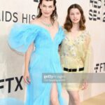 Milla Jovovich Instagram – Thank you @amfar for being a ray of light in this dark world right now. I am so proud to support all the incredible break throughs in medicine that this organization has made possible over the years through their fund raising for people living with HIV/AIDS as well as raising awareness for the prevention of the disease. I was lucky enough to be dressed for the gala by my fellow Ukrainian, the incredible designer @lever_couture! Together, my daughter @everanderson and I completed the Ukrainian flag with our colors on the red carpet! A special thank you to @messikajewelry and my amazing glam team: make up @patidubroff and hair @cyrillaloue!