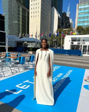 Amanda Gorman Instagram - Still in awe that I had the honor of speaking beside these lovely ladies @unitednations #GeneralAssembly this week as a supporter of @unicef . By supporting the Sustainable Development Goals, we share a universal call to action to end poverty, protect the planet, and pursue peace. I can’t tell you how many times I’ve been told a single poem can’t change the world. What I know is that if you look closely enough, the world IS changing—there are movements and actions waiting for our involvement, spearheaded by future generations. And I can’t imagine anything more worthy of naming, celebrating, writing, believing, and joining. 💛🙏🏿🇺🇳🌍

EXCERPT FROM “AN ODE WE OWE: A POEM FOR HUMANKIND” 
 
We must go the distance,
Though this battle is hard and huge,
Though this fight we did not choose,
For preserving the earth isn’t a battle too large
To win, but a blessing too large to lose.

This is the most pressing truth: 
That our people have only one planet to call home
And our planet has only one people to call its own.

We can either divide and be conquered by the few,
Or we can decide to conquer the future, 
	And say that today a new dawn we wrote, 
	Say that as long as we have humanity,
We will forever have hope.