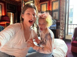 Milla Jovovich Instagram - Oui Oui Baguette! The Jovovich-Anderson Clan sans bébé have arrived in Paris pour fashion week! Well, actually @everanderson is the only one who’s actually doing fashion week stuff and the rest of us are just hangers on, mooching off our eldest✊😂🥳 Thanks Evs, @veesback @chrissbrenner and @miumiu for this amazing family trip!🥰🥰🥰