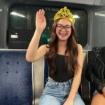 Anna Cathcart Instagram - happy_girl_with_tiara_on_bus.JPEG