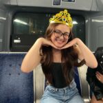Anna Cathcart Instagram - happy_girl_with_tiara_on_bus.JPEG