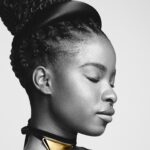 Amanda Gorman Instagram - Introducing @Prada Eternal Gold, the first truly sustainable fine jewelry collection by a global luxury brand using 100% certified recycled gold. It’s such an honor to be part of history being made in this first #PradaFineJewelry line 💛 

As we move into the holiday gifting season, it’s important for me to research brands whose jewelry contributes to more environmentally mindful solutions that push for an industry standard of sustainability. This line is not only made of recycled material, but also every piece’s origins are traceable via Aura Consortium Blockchain’s platform. The jewelry in this collection are made all the more beautiful by the effort to establish more sustainable sourcing practices, a cause that truly is golden.

@prada photo by @davidsimsofficial