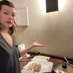 Milla Jovovich Instagram - Happy New Year from the Andersons! This post goes back in time of our epic New Year’s Day. It starts with a hard won family photo where almost everyone is in focus.  Before that I made dinner in our hotel using a one burner hot plate (half the food was pretty lukewarm but still delicious). I made my mom’s famous fried potatoes which is always a hit with the kids, but also some gorgeous asparagus and trumpet mushrooms fresh from the farmers market here in Krakow. I even have my super Eastern European wire rack where I keep the veggies☺️. And of course this morning started with an epic New Years trip to the laundromat which though not very glamorous, was extremely necessary😂. I’m sending so much love to everyone and I hope this New Year brings us all health, love and patience for ourselves and others. Ok, it’s time to put the baby down. Have an amazing night everyone!🍾🎆🎊🎉🎈xo m❤️