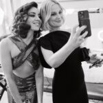 Aubrey Plaza Instagram - Best dress ever! Best date ever! Best team ever! Thank you @michaelkors for this beautiful custom dress making me feel like a 70’s movie star 🤎🤎🤎
Jewelry by @mouawad 
Styled by @highheelprncess 
Makeup by @kathyjeung 
Hair by @marktownsend1 
Color @traceycunningham1 
Nails @jolene.b.nails