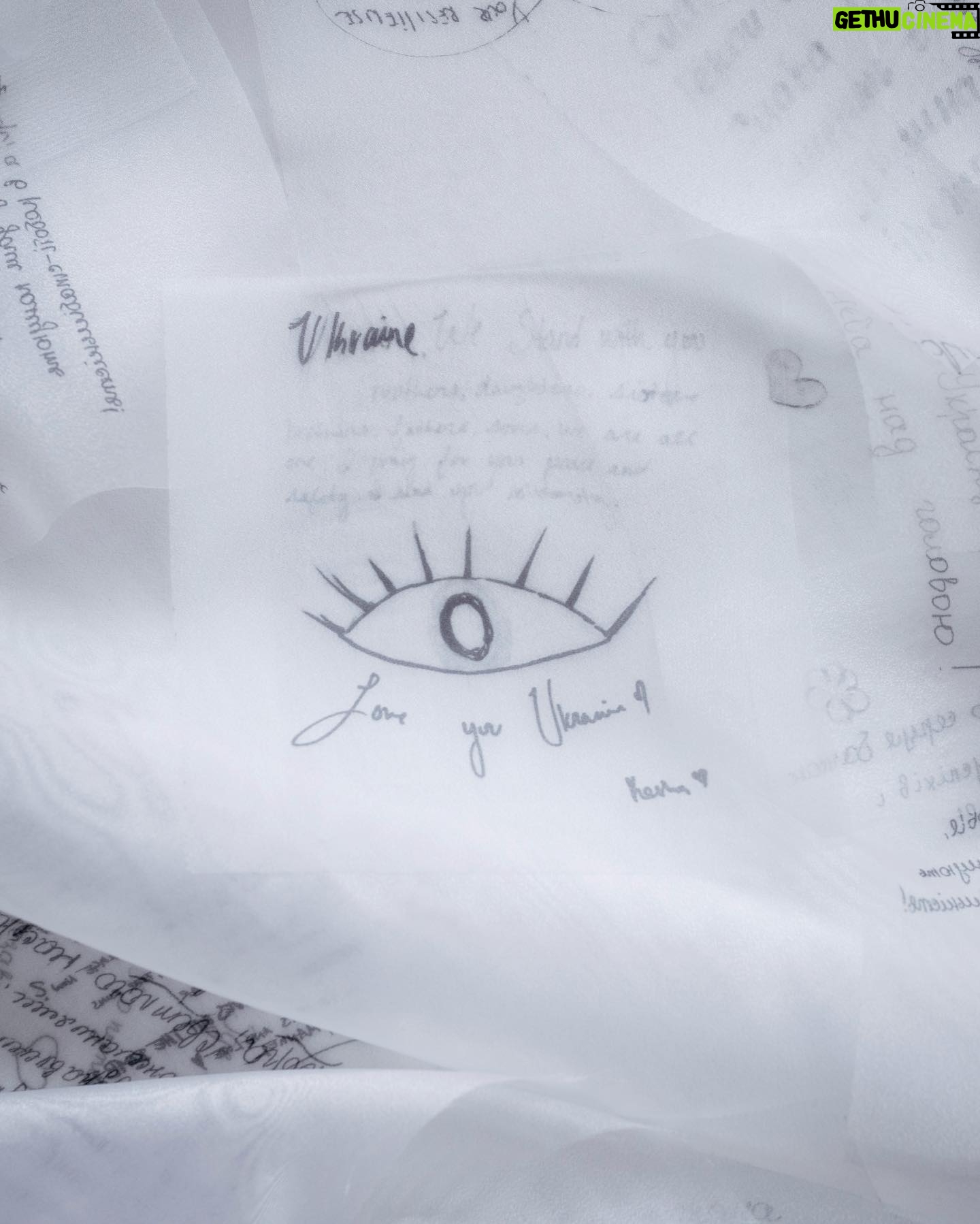 Milla Jovovich Instagram - Today marks the one year anniversary of the war on Ukraine. I am working with exceptional Ukrainian designer @lever_couture who is taking “love letters” for Ukraine and sewing them by hand on a couture gown which will be auctioned off with all proceeds going to @zelenskafoundation. Here are some pics of the amazing process of making this one of a kind gown! My letter was written as a poem which you can read below:
My motherland cries tears of smoke and ashes
Her men fight with the ingenuity of true belief
So many hearts, so many women torn in pieces
Of husbands, children, cats and curtains, blown out flats
Windows, plates and tea cups, ethics and ideals bombarded by the sounds of missiles landing at the door
The bodies of their men, forced to become hero’s
Whether they wanted to or not
Their scent, their touch, their familiar voices Whispering words of desperate comfort and of everlasting love
Ripped away, maybe for now, maybe forever
I love you…
Whispered fiercely into a beloved ear
I love you whispered fiercely into the wind
As the gunfire and the blood drenches Everything and all
I love you Ukraina.
I love you as my ears explode
#waronukraine