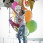 Milla Jovovich Instagram - Happy 8th birthday to my sweet, kind, thoughtful and most loving little girl Dash! She’s really the rock of our family. Such an amazing big sister to the baby, such a wonderful little sister as well. Here are some pics with the cards that we made for her! I collaged a “Magical Treehouse” card and her dad made a collage of the two of them over the years. Her older sister made the most beautiful and creative pop up card that’s so cool! Also thank you to @ballooncelebrations for the epic balloon fantasy land she woke up to this morning!