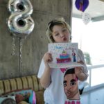 Milla Jovovich Instagram - Happy 8th birthday to my sweet, kind, thoughtful and most loving little girl Dash! She’s really the rock of our family. Such an amazing big sister to the baby, such a wonderful little sister as well. Here are some pics with the cards that we made for her! I collaged a “Magical Treehouse” card and her dad made a collage of the two of them over the years. Her older sister made the most beautiful and creative pop up card that’s so cool! Also thank you to @ballooncelebrations for the epic balloon fantasy land she woke up to this morning!
