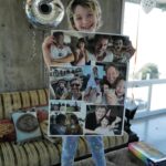 Milla Jovovich Instagram - Happy 8th birthday to my sweet, kind, thoughtful and most loving little girl Dash! She’s really the rock of our family. Such an amazing big sister to the baby, such a wonderful little sister as well. Here are some pics with the cards that we made for her! I collaged a “Magical Treehouse” card and her dad made a collage of the two of them over the years. Her older sister made the most beautiful and creative pop up card that’s so cool! Also thank you to @ballooncelebrations for the epic balloon fantasy land she woke up to this morning!