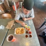 Jayden Bartels Instagram - I made guy groove drive me around in this cool truck then we got sharkys and this goof got every possible salsa you could get plus just carrots? on the side? an experience (also new YouTube video is up😋)