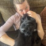 Milla Jovovich Instagram - Happy Saturday from me and the newest member of the Jovovich-Anderson clan, Wellington! We rescued this huge baby beastling from an animal hospital where he’d been abandoned dying of pneumonia because the owner couldn’t afford to pay the bills. Poor guy was just skin and bones. But as you can see, he’s super healthy and happy now lying on his mama’s lap and getting all the love and cuddles any dog could ask for! He’s settling in well, but we’re still potty training him so he’s got a doggie diaper on😂. Before people worry, I make sure he goes outside every time he drinks water, so he spends most of his time without them. But when he’s hanging on the couch with the family, we need to be cautious or I have A LOT of cleaning to do when he has an accident🤦🏻‍♀️ Anyway, hope you’re all doing great and sending lots of love your way!❤️❤️❤️