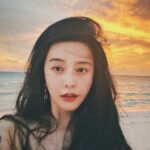 Fan Bingbing Instagram - Sunset by the beach.