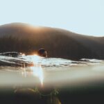 Jessie Reyez Instagram - The amount of peace I feel when I swim out into the middle of a lake is almost inexplicable. Almost. But I’ll try. I think I love it so deeply because a lake is an expression of the unknown, where when I open my eyes, the darkness seems wildly infinite…and yet all the while it reminds my subconscious of the womb we came from. 
I find clemency here. 
I find a sovereignty in water that land has never been able to give me. 
It pardons the gravity of life.
And in that forgiveness 
And in that weightlessness 
I am free. 

📸 @danecollison
