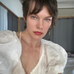 Milla Jovovich Instagram - Good morning! I’ve had a chance to spend some time on my own to catch up on work and just have some me time! Summer is no joke with kids out of school and it’s been busy in the Jovovich-Anderson household with 3 kids and 3 dogs! Apart from catching up on some great tv shows, I’ve been adapting a book into a screenplay (it’s not sci fi either hehe), which has been a very interesting experience. I’ve always loved writing and this has actually made me love and understand this book so much more because suddenly the characters have taken a life of their own in my imagination. Different from just reading it because I’m actually able to allow them to speak their thoughts out loud, if that makes sense. I’ve also been doing some more artwork on my walls. Some of you commented on the art behind me in my last post and I decided to mess around with it some more because I wasn’t happy with it when I drew it and kind of left it for a while. (Swipe to the end to see what it’s turned into.) I think it’s pretty cool so far, but my wall art is always developing and changing which is a lot of fun. Every morning I exercise my dogs, but especially my huge, dragon dog Welly. I call him my personal dragon because he’s enormous, super protective and when he jumps to catch the ball, he looks like he should sprout wings. I also got some rad pictures of some beautiful flowers that just came up in our backyard. I’m not sure what species they are, but they’re drought resistant because they’ve managed to survive here as innocuous bushes even without water for ages before the rain came and then suddenly flowered into these brightly colored beauties. I got a picture of a bee on one of them (towards the end of the series) and on another I zoomed in and realized that a fly landed on the same flower as the bee! Kind of strange but I think it’s a great moment. Anyway, enjoy my photo dump of the last 12 hours! Have a great day everyone!💥