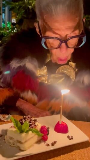 Iris Apfel Instagram - A big THANK YOU for all of the birthday wishes this week!!!! Here’s me making my wish… turns out they couldn’t fit 102 candles in the strawberry 🍓🎂🎈
