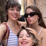Milla Jovovich Instagram - I’m so excited to have been invited to attend the @amfar event and help raise money for this cherished cause in Venice, Italy! It’s been a healthy decade I haven’t been to Venice and it’s such a dream coming back here. Riding from the airport in a water taxi, watching the delicate, medieval city, opening up before me in such a calming and soothing way after a long and sleepless flight. The feel of the boat rocking underneath me is already getting me prepared for delights to come. We float on the water and get dropped at our hotel, which is a thousand year old monastery that was actually abandoned for over one hundred years before it got renovated into a hotel.  A bit on the spooky side, but I’m totally in to see some ghosts, hands down!  The light is so gorgeous everywhere that even with no sleep on the flight (I started playing Baldur’s Gate 3🤯 and I wasn’t about to have something as pesky as sleep stop me from jumping down that rabbit hole😂 ) I just put on minimal make up, tinted sunscreen, mascara, spf lipstick, I feel red carpet ready! This light ignores signs of jet lag and literally gives you a wink and secretly hands you 5 years back without even asking for a thank you. We’re only here for a few days, @everanderson is here working with the wonderful team @miumiu, doing her thing  and we brought our little Dash with us so we could make her feel grown up and special. It’s hard to give all three of my girls proper mama time when our 3 year old , Osian, is around. She’s just a mighty force of nature that demands absolute and undivided attention and the more you give, you know it’s only enough when your essence has completely disappeared into her own. She’s a smart kid😂. Goes without saying that we’re having a blast! I’ll go through more photos and do a nice dump when I get home! Thank you @amfar again for believing in me and having me here to support you for so many amazing years and thank you @miumiu for always taking care of my incredible young woman, my heart, Ever. ❤️🧨💥✨✨✨