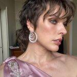 Milla Jovovich Instagram - What a beautiful trip to Venice I had! Thank you so much @amfar for all the amazing work you’ve done and congratulations on raising over $2 million for AIDS research! I’m so proud to have worked with your organization for over two decades and help raise awareness to such an important cause. Also, a big shout out to @chopard jewels for the gorgeous earrings I got a chance to wear for the evening and @prada for making me this glorious gown so many years ago for the red carpet in Cannes that I got the chance to wear again for this gala! My family and I had so much fun exploring the city and I have so many wonderful pictures to share, but I couldn’t fit them all in one post, so I’ll be posting more once I have the chance to go through them. These are some of my favorites from the night of the event and I’ll choose more from my personal family pics and put them up when I get a chance!💋❤️✨
Thank you to my amazing glam squad:
Make up: @nikipinna
Hair: @la_pellizzaro