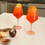 Jessie James Decker Instagram - My beautiful @justfeedme wineglasses at @walmart are now live🥰 Enjoy a glass for me while I drink this non spiked apple cider 😂🍎🍷🍾