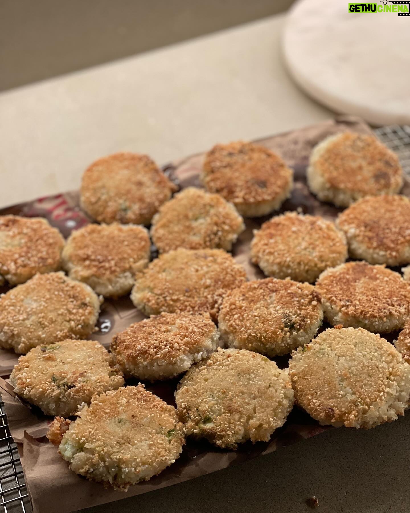 Mayim Bialik Instagram - Couldn’t resist sharing some festive cooking posts. These first 2 photos are broccoli arancini from @Moby’s Little Pine cookbook, which I make with gluten-free Panko.
Next up are my veganized “Darrell’s ‘Forget-the-Cookies-Just-Give-Me-That-Batter’ Chocolate Chip Cookies” that I was in the process of making during yesterday’s Live with @jonathancohenofficial (head over to @bialikbreakdown if you missed it!). Shout out to my 1987 edition of KidsCooking: A Very Slightly Messy Manual from Klutz press (a pretty cool company) for the recipe.
INGREDIENTS:
- 1/2 cup vegan butter
- 1/2 cup brown sugar
- 1/2 cup white sugar (yes, it’s a lot of sugar, but that’s why I only make them for the holidays 😬)
- 1 tsp vanilla extract
- 1 vegan egg replacement (I use Bob’s Mill egg replacer)
- 1 1/8 cups flour (If I’m feeling frisky, I replace 3/4 cup of the flour with cocoa. That’s what I did with this recipe. 🤫
- 1/4 tsp salt
- 1/2 tsp baking soda
- 1 bag (6 oz) vegan chocolate chips
- 1/2 cup walnuts - optional (sometimes I make them with pecans but this time I did it with walnuts)
INSTRUCTIONS:
1. In a small pan, melt the butter. While it’s hot, add both sugars. Stir, then let cool a bit.
2. While the butter mixture is cooling, mix the flour, baking soda, and salt in a mixing bowl.
3. In a separate small bowl, stir the egg replacer in with the vanilla and butter mixture.
4. Add the butter, egg replacer, and vanilla to the flour mixture in the mixing bowl. Stir again, then add chocolate chips and nuts if you want them.
5. Stir everything until it’s all mixed up well and put the bowl in the refrigerator to cool for about an hour.
6. Preheat the oven to 375 degrees F.
7. Roll the dough into walnut-sized balls, put them onto an ungreased baking sheet, and bake for 10 min. Allow to cool, and enjoy!