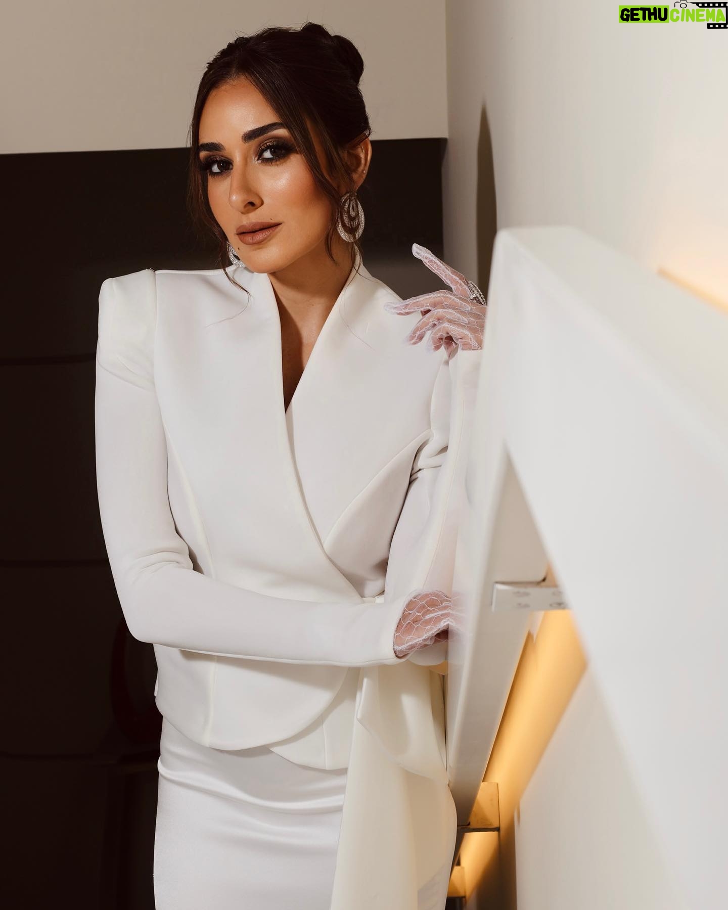 Amina Khalil Instagram - A few shots before the world premiere of our latest film ‘Shamareekh’ followed by the star-studded Vanity Fair party ‘Women In Cinema’..
📸 @soma_photography19
This look was created by:
Stylist: @mohamedashraff
Dress: @dazluqofficial
Jewels: @chopard
MUA: @nohaezzeldinmua
Hair: @alsagheersalons
Lots of love,
-A.