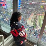 Chanel Iman Instagram – Our baby girl Capri’s first football game🏈 @chauxdown ❤️Team Godchaux @patriots 🙌🏾