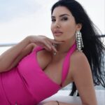 Lamitta Frangieh Instagram - The countdown is on, glam it for the upcoming year from @polinis_boutique  unique items 💫
Get my look with this amazing fushsia dress & crystal sandals ! 
Location : La ville suite , city walk 

📸 @hossamelhalwagy_photography