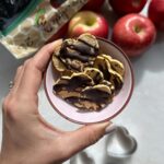 Daniella Monet Instagram - This deserves to go viral. Air fried apples drizzled with chocolate?!?!? This truly only works if you have the right apples. They have to be juicy   sweet, like @sugarbeeapple

Send this to the Apple of your eye to tell them that you LOVE THEM❤️

Also, comment APPLE for this recipe!

Do you know how SugarBee apples came to BEE?

One sunny spring day, a honey bee was buzzing throughout Mr. Nystrom’s orchard, collecting nectar and cross-pollinating apple blossoms along the way. The honey bee stopped at an unknown tree and collected nectar and pollen from a blossom.  As the day went on, the little honey bee passed that pollen onto a Honeycrisp blossom. Little did this bee know its cross-pollination between a Honeycrisp and an unknown variety had just resulted in the beloved SugarBee® apple!

Like are you kidding me? 🐝🍎 

#ad #FromBeeToYou #SugarBeeApples #OhHoneyThatsGood @sugarbeeapple