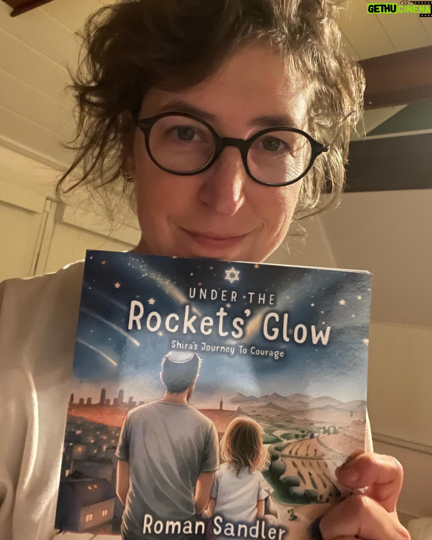 Mayim Bialik Instagram - This is a children’s book that was written because the author was trying to explain what’s going on in Israel to his five-year-old daughter and he couldn’t find a resource with which to do it so he wrote one himself. Under the Rockets’ Glow: Shira’s Journey to Courage by Roman Sandler is beautiful and I recommended highly. Link in bio
