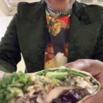 Tabitha Brown Instagram - So while in Chicago we were also blessed by @tastes_of_bri 🙌🏾 She came to the theater with all the goodness🙌🏾. Baaabbbyy she made us jerk oyster mushroom wraps and sweet potato heaven rolls(that’s what we called them😂) from the way we was all eating, I think you know how it tasted😂😂😂. Thank you so much Bri, we love and appreciate you honey!! Yall be sure to visit and support her in the south side of Chicago!!!! Very Good!! #tabithabrown #chicago #vegan #food #plantbased 
📸 @tifftylerfilm