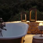 Nikki Reed Instagram - My favorite place in the world, and these @arhaus solar lanterns sure do make outdoor bath parties that much more fun! But don’t let the music fool you, without it you would be listening to action figures jumping off of bathtub hardware plunging into the deep blue sea to meet their mermaid friends :) … 🧜‍♀️