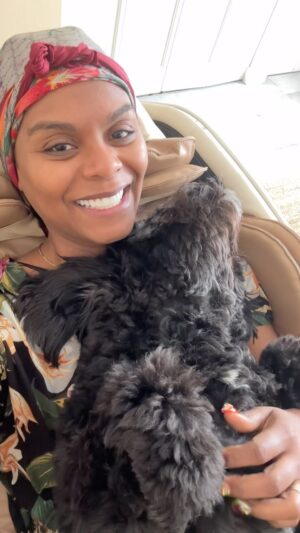 Tabitha Brown Instagram - Apparently Saturdays are for sleeping in and cuddling ❤️ per @iamblackybrown … honey he ain’t quite ready for the day yet😂. #tabithabrown #furbaby #dogsofinstagram #dog #cockapooterrier