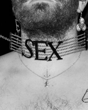 Vivienne Westwood Instagram - BEHIND THE SCENES: Echoing the ‘Blackout’ theme, @samsmith ‘s bespoke Vivienne Westwood show looks are presented in shades and textures of black.⁠
⁠
For the opening look, Sam appears in a double-breasted cropped jacket with braided epaulettes and aiguillettes worn with sailor trousers.⁠
⁠
Later in the show Sam reveals a corseted bodice paired with our iconic SEX choker and spiral lace gloves with claws.
