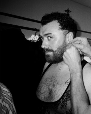 Vivienne Westwood Instagram - BEHIND THE SCENES: Echoing the ‘Blackout’ theme, @samsmith ‘s bespoke Vivienne Westwood show looks are presented in shades and textures of black.⁠
⁠
For the opening look, Sam appears in a double-breasted cropped jacket with braided epaulettes and aiguillettes worn with sailor trousers.⁠
⁠
Later in the show Sam reveals a corseted bodice paired with our iconic SEX choker and spiral lace gloves with claws.