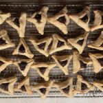 Mayim Bialik Instagram – Hamantaschen stats from yesterday’s baking Live:

Regular —
Chocolate : 25 closed, 0 open – 100% success 
Apricot : 13 closed , 7 open – 65% success 
Strawberry: 5 closed , 13 open – % 28% success 

Gluten Free —
Chocolate : 7 closed , 0 open – 100% success 
Apricot : 10 closed , 2 open – 99 % success 
Strawberry: 9 closed , 3 open , 1 fell on the floor and was this excluded from the tabulation – 75 % success 

First photo – GF
Second photo – Regular 
Third photo – Fred is pointing to the open one he will eat first lol